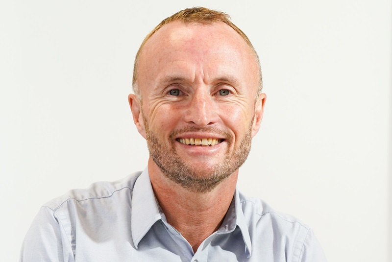 A headshot of Andy.